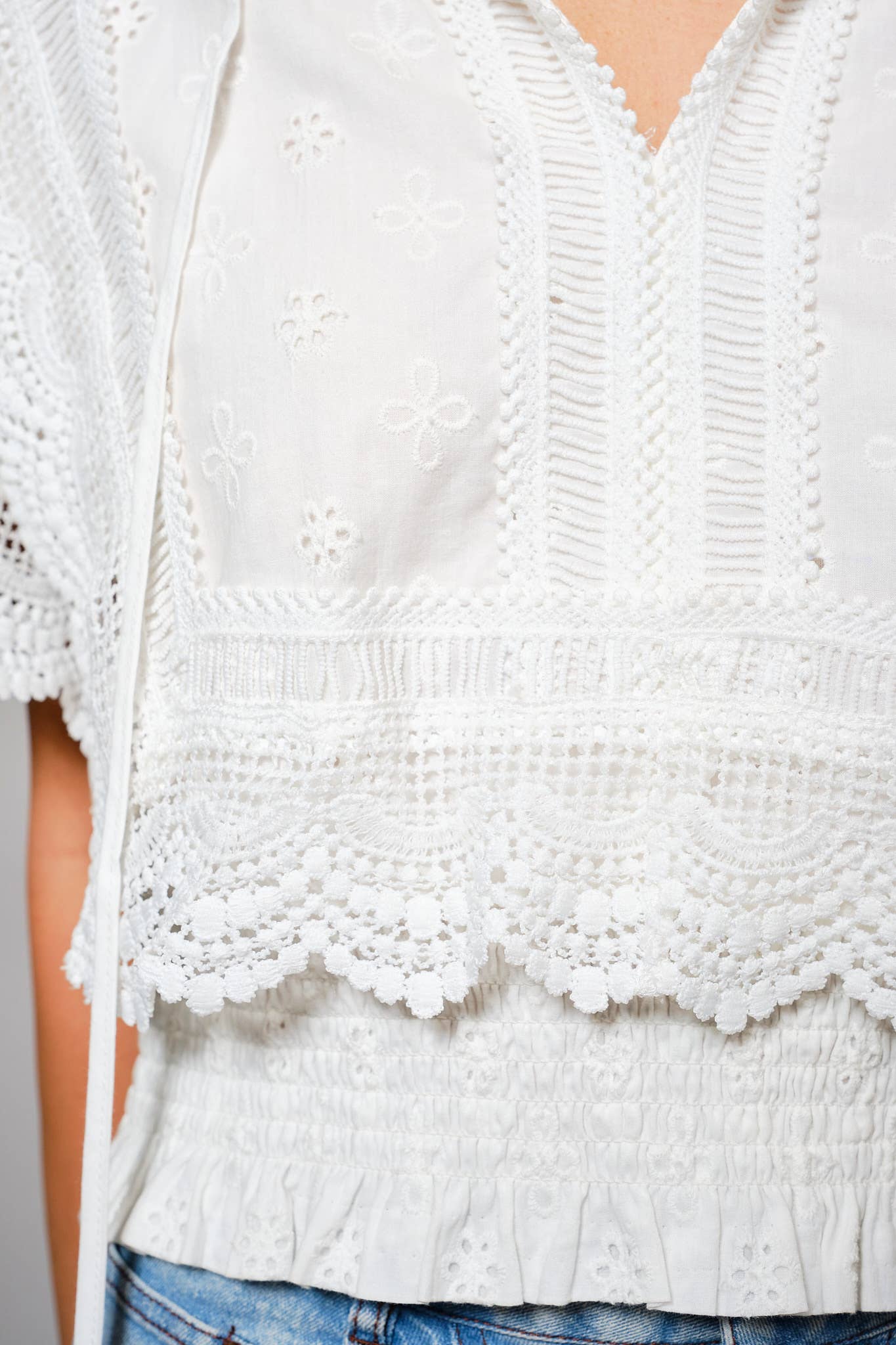 36900T - Eyelet Embroidered Tassel Tie Front Crop Top